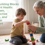 Grandmother and grandson kneeling together on a rug, stacking a colorful wooden block tower in a bright living room